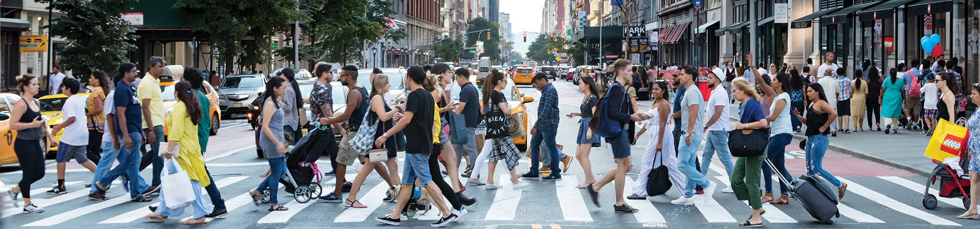 People walking across the street